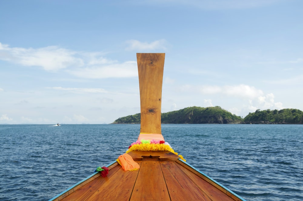 brown wooden boat on sea during daytime