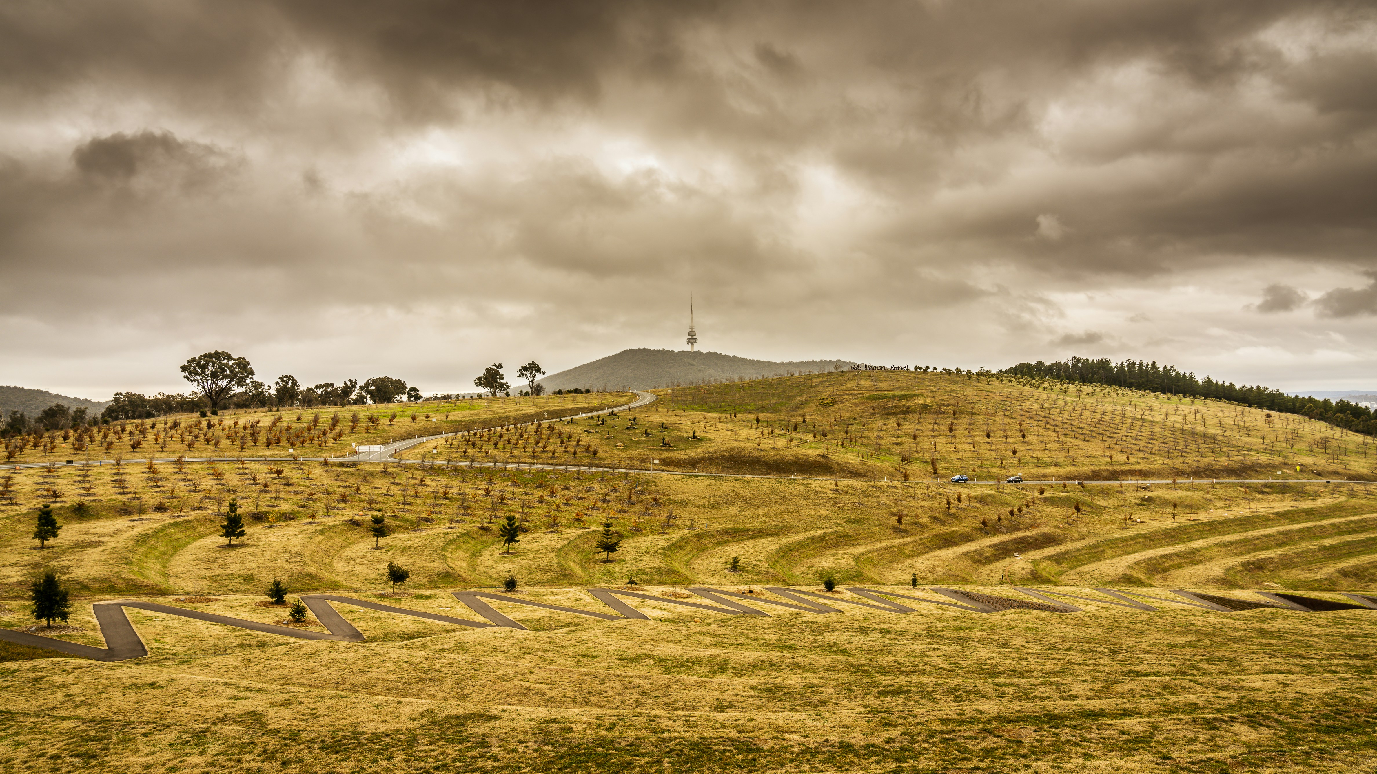 green grass field under cloudy sky during daytime, 