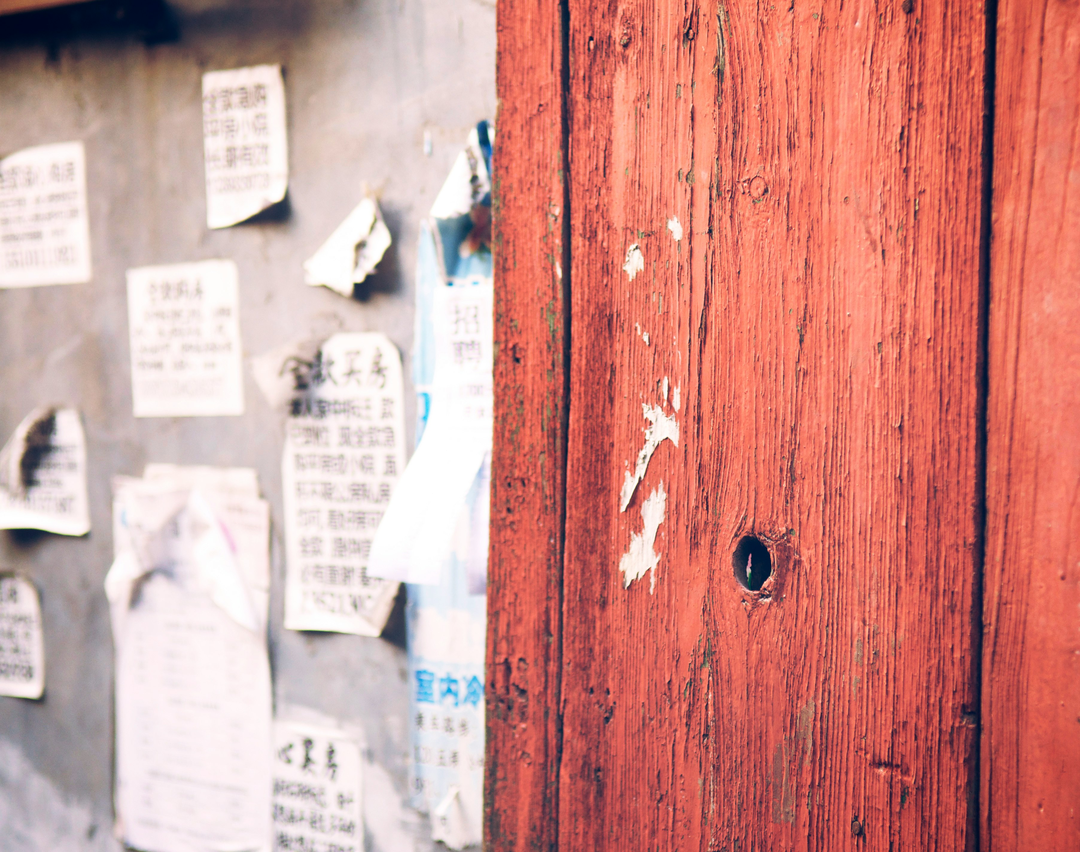 white printer paper on brown wooden door