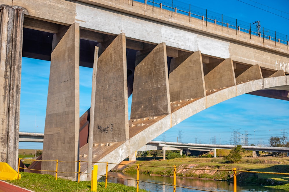 gray concrete bridge over river during daytime