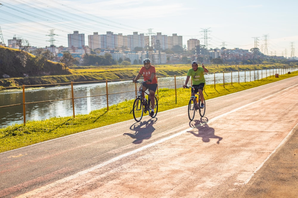 man in black jacket riding bicycle on road during daytime