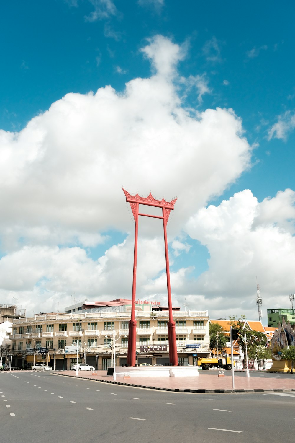 brown concrete building under white clouds during daytime