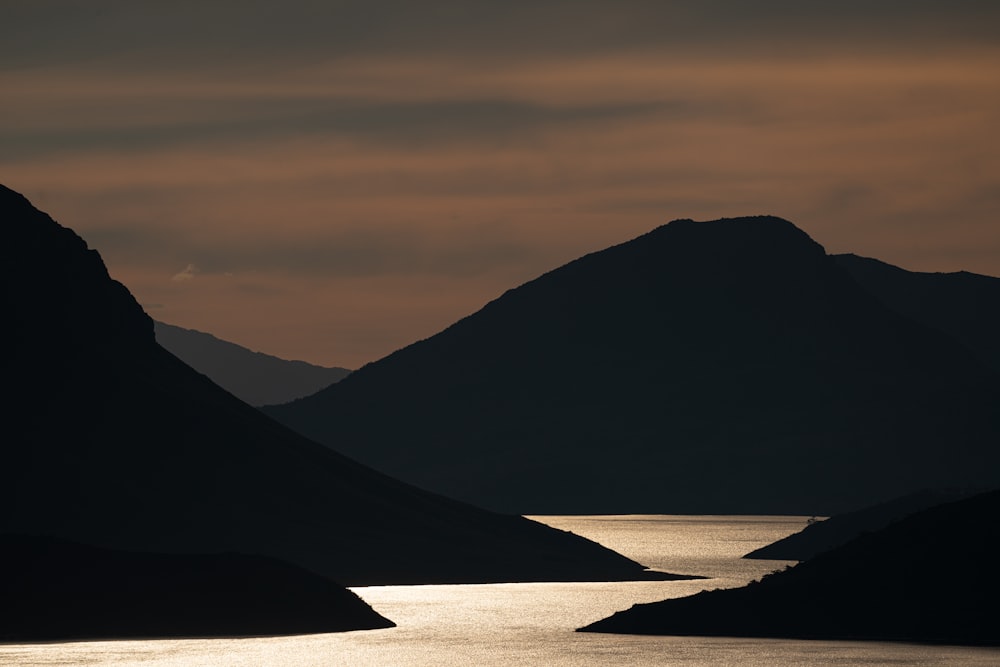 silhouette of mountain during sunset