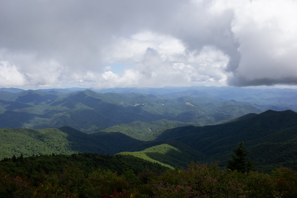 green mountains under white clouds during daytime