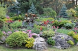 A vibrant garden with colorful flowers and decorative stones, perfect for Florida homes.