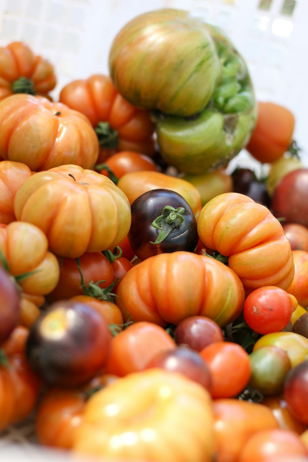 green and orange round fruits