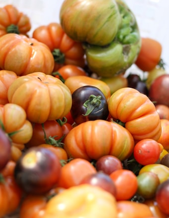 green and orange round fruits