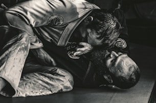 man in black shirt lying on floor