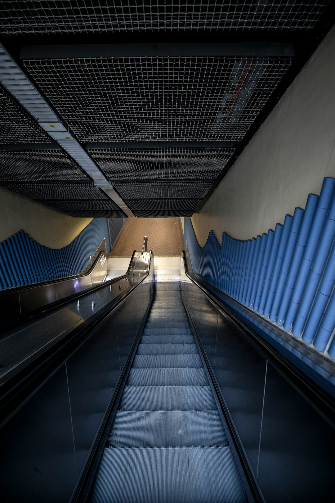 people walking on black escalator