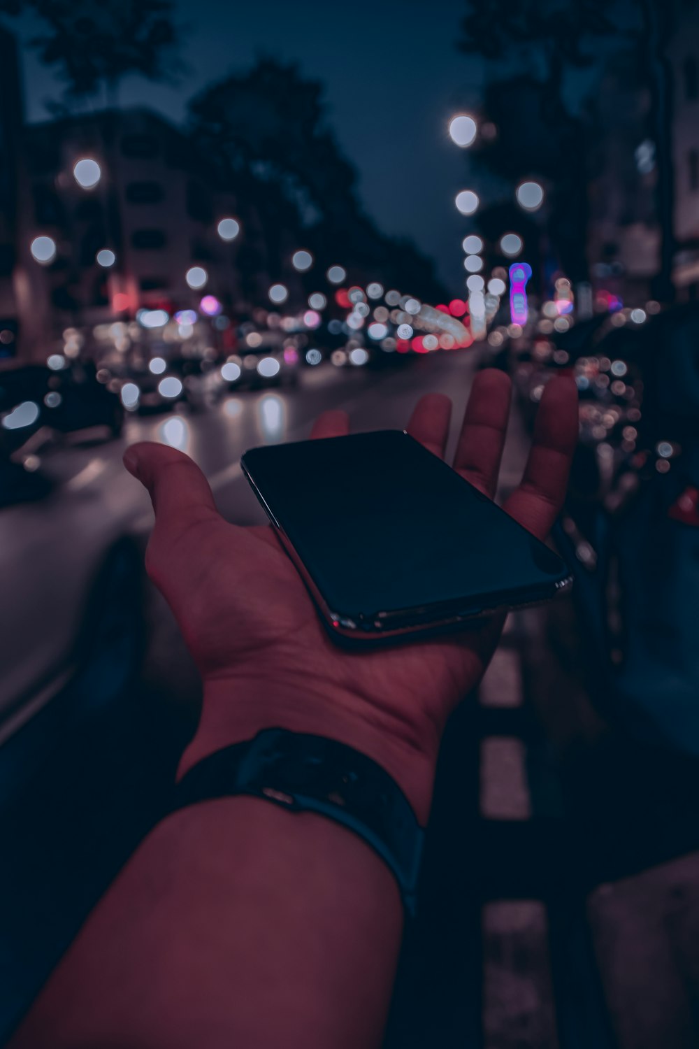 person holding black android smartphone