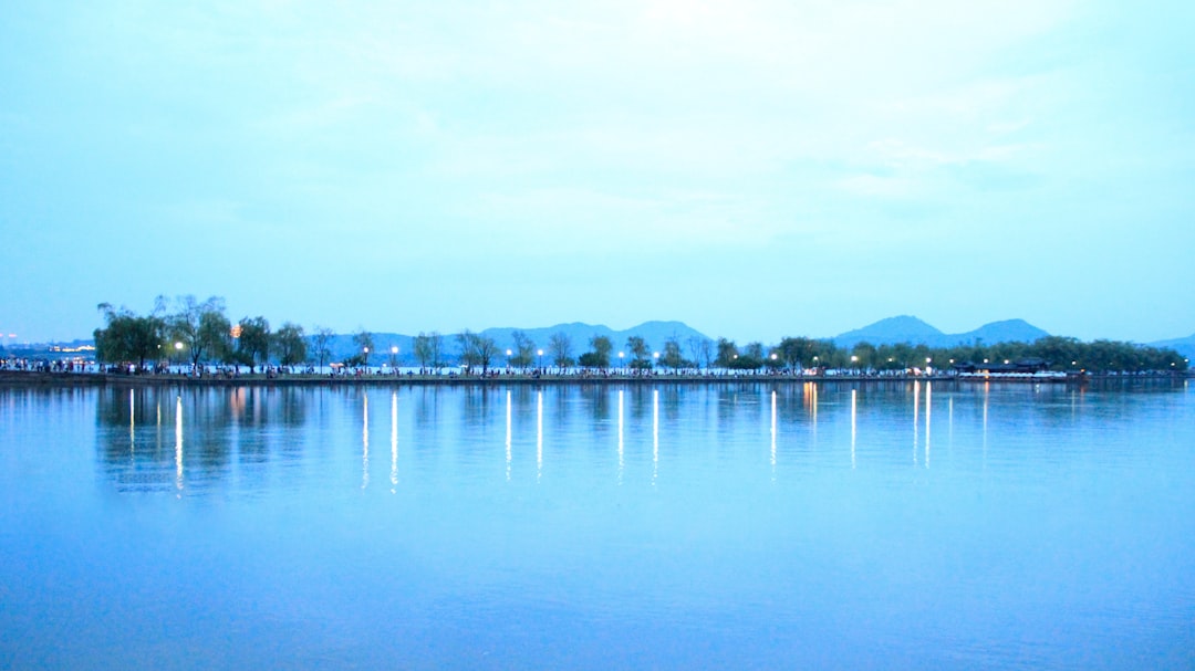 body of water near city buildings during daytime