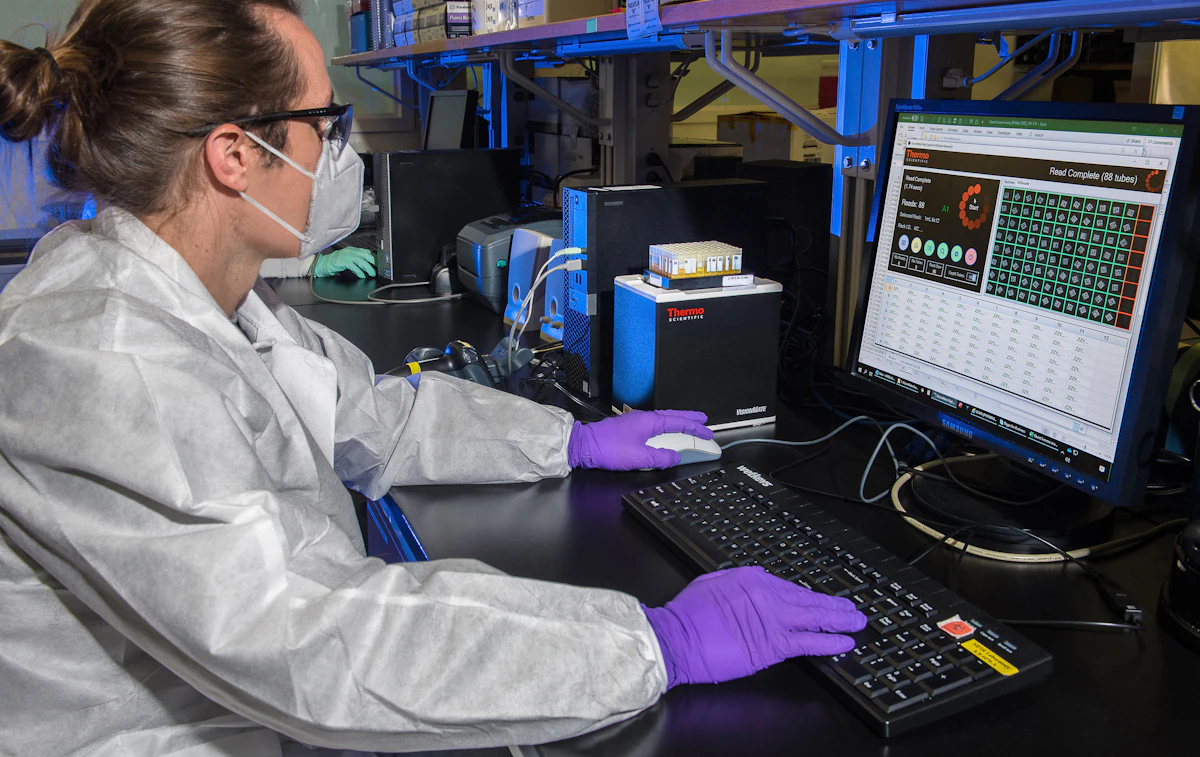 Scientist reviewing structured results on a computer in the laboratory