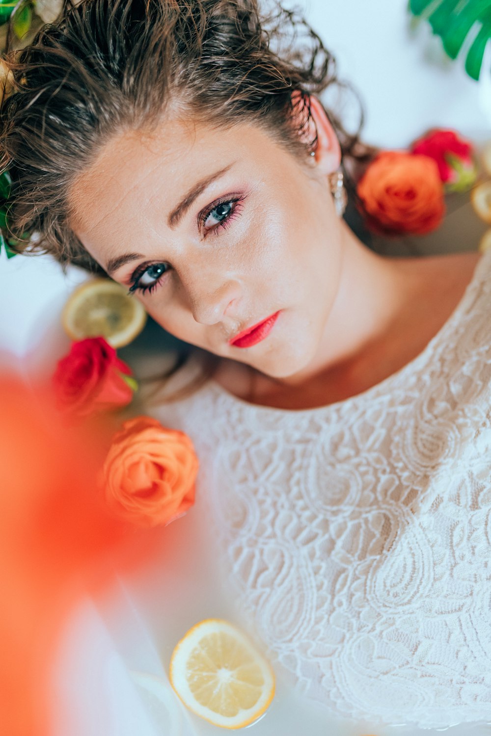 woman in white floral lace shirt