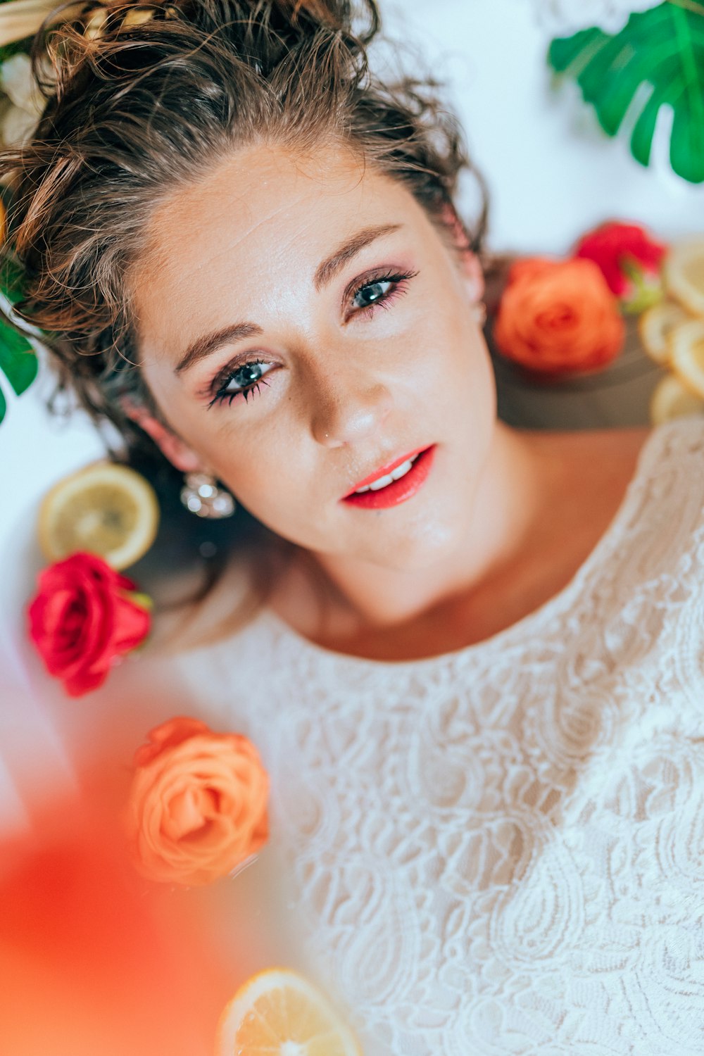 woman in white floral lace shirt