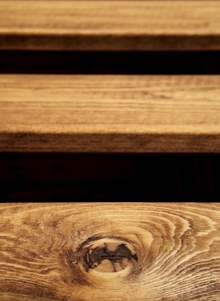 Close-up of wooden planks with natural grain and warm tones.