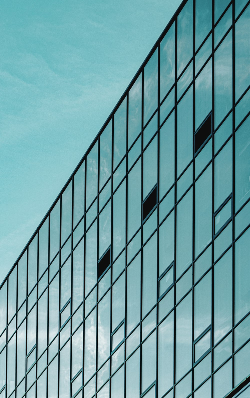 white and black concrete building under blue sky during daytime