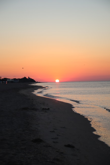 A beautiful sunset on a serene Indian beach.