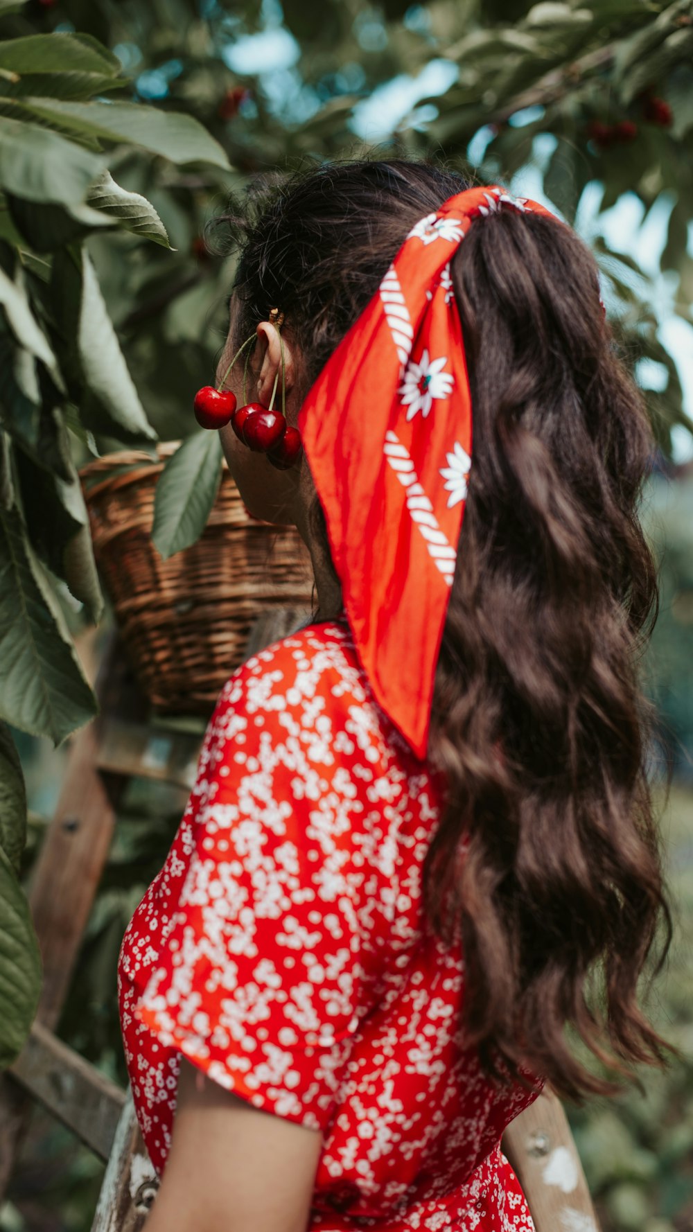 woman in red and white floral dress