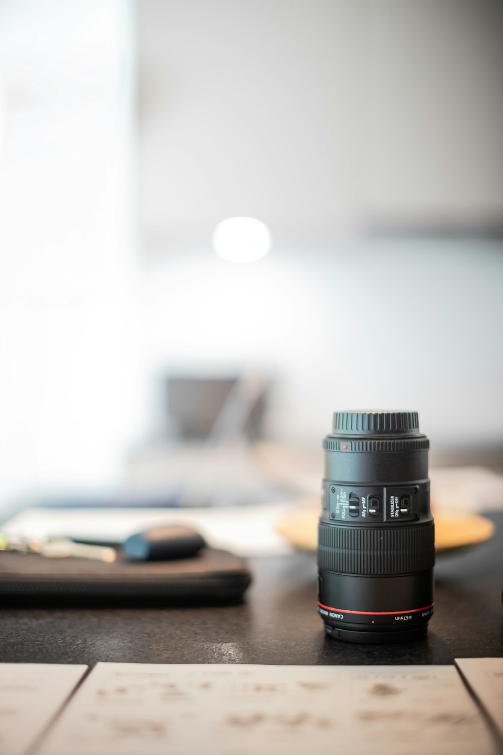 black camera lens on brown wooden table