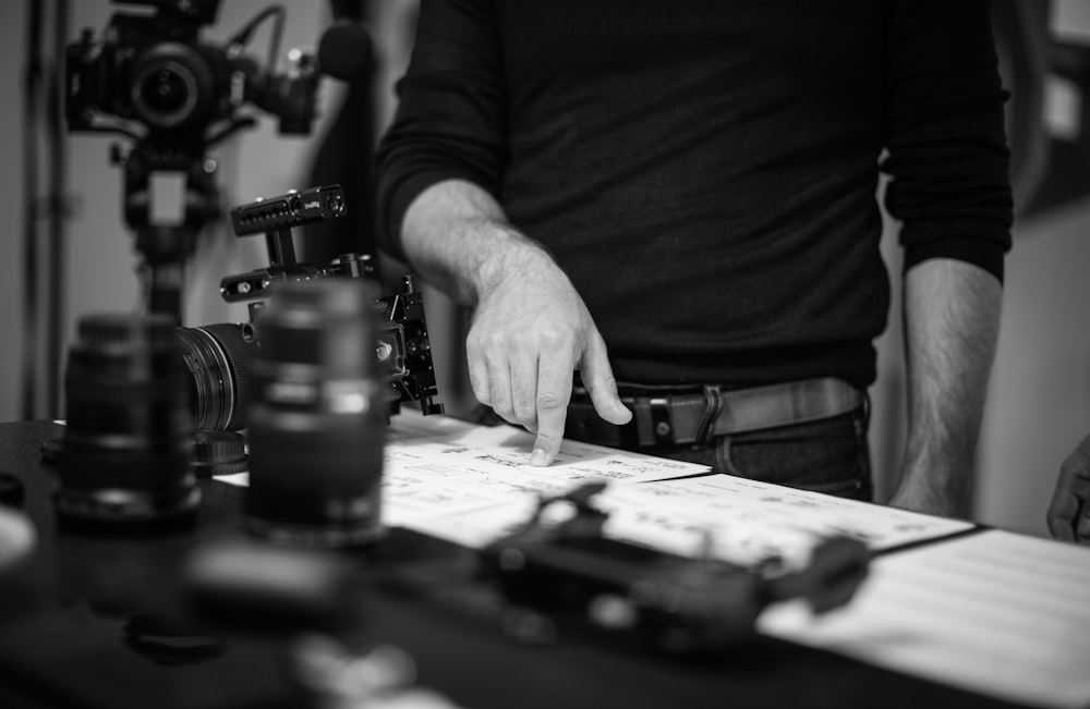 grayscale photo of person playing chess