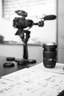 black camera lens on white printer paper