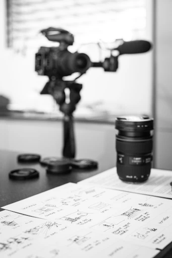 black camera lens on white printer paper