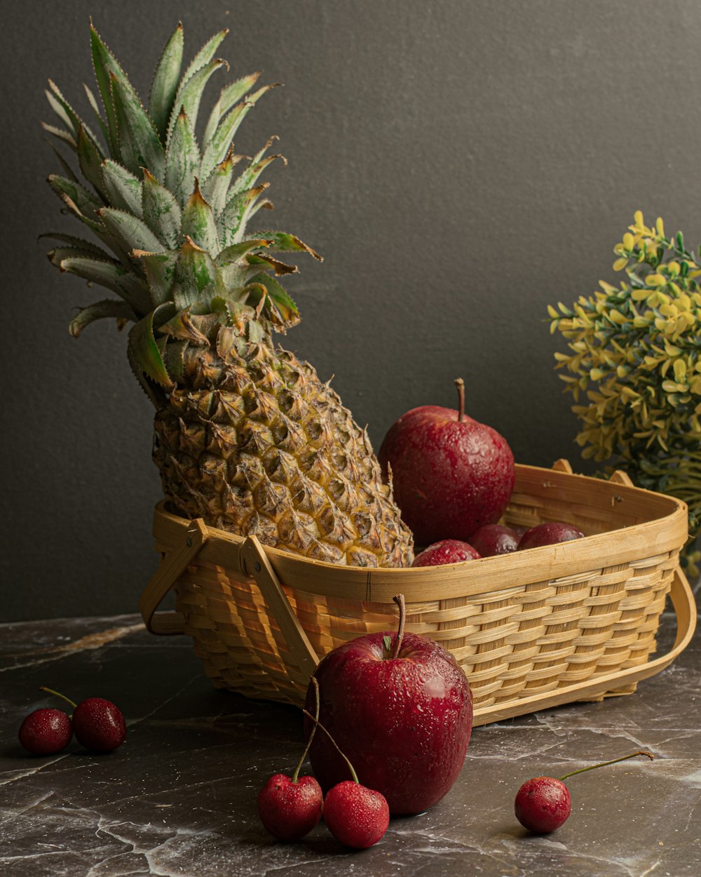 red apple fruit on brown woven basket