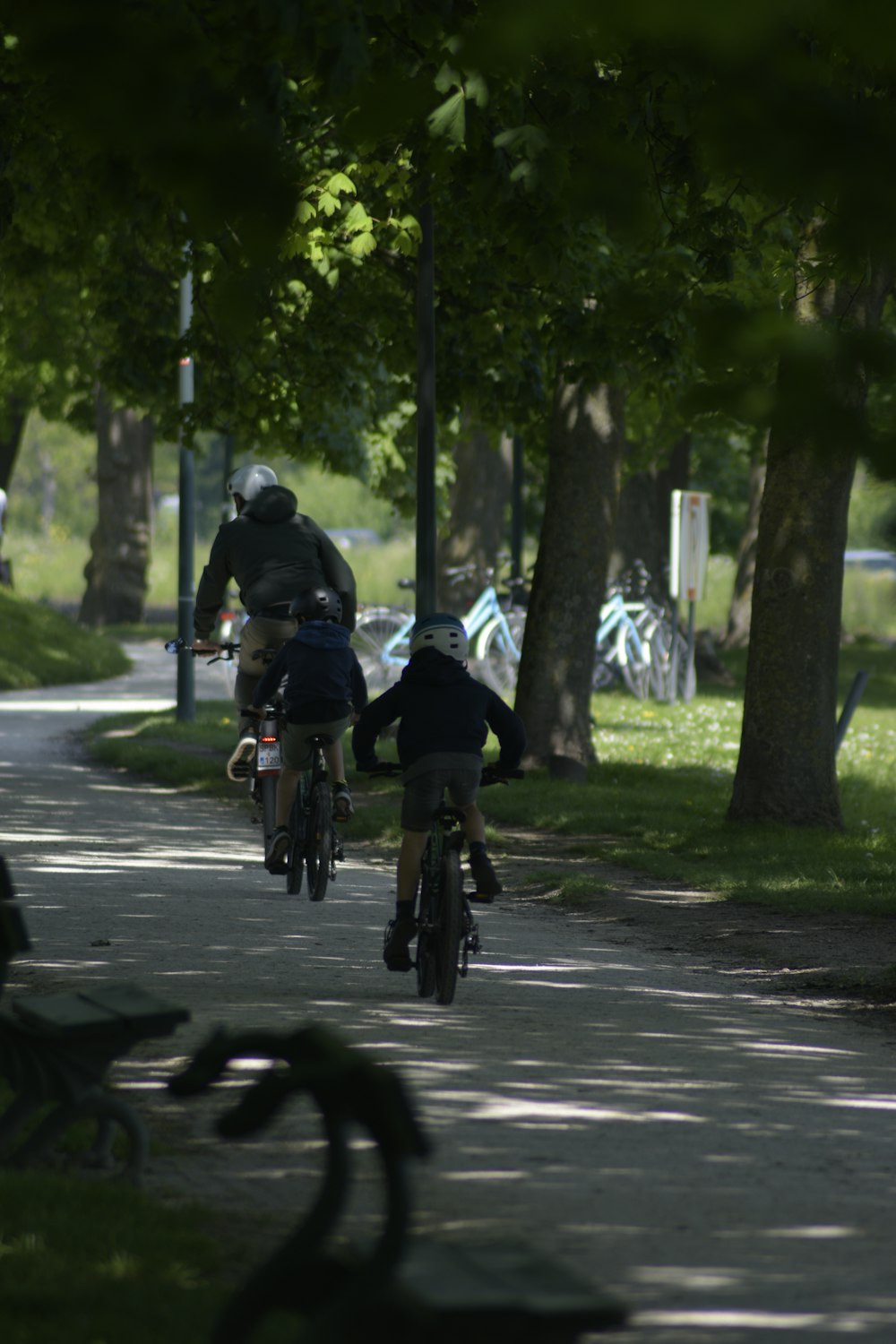 people riding bicycle on road during daytime