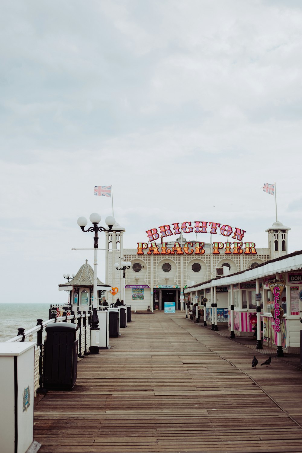 white and red concrete building near sea during daytime