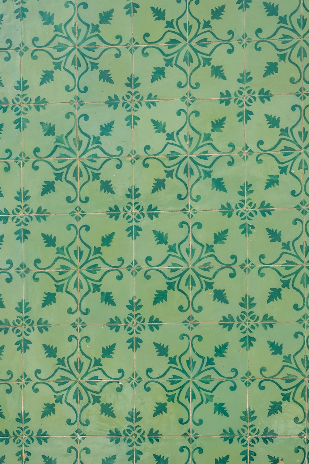 green and white floral textile