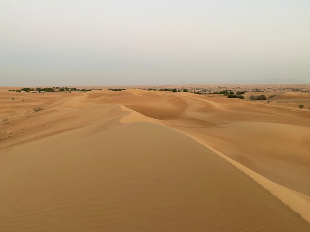 brown sand under blue sky during daytime