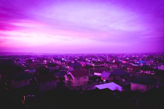 A panoramic view of Biggleswade cityscape at dusk with violet hues blending into the skyline.