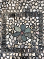 Different types of decorative stones arranged in a mosaic.