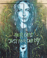 A mural painted on a wall depicting heroes of the anti-mafia movement.