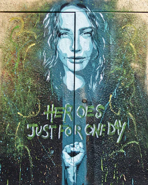 A mural painted on a wall depicting heroes of the anti-mafia movement.