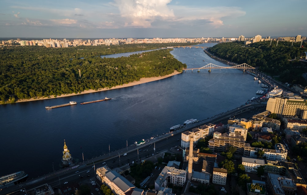 aerial view of city buildings near body of water during daytime