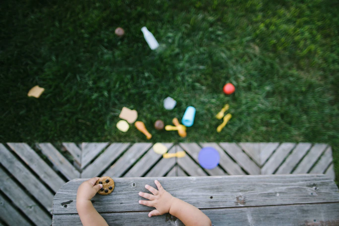person sitting on brown wooden floor