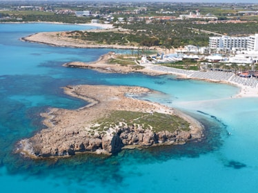 aerial view of city near body of water during daytime
