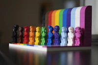 multi colored plastic blocks on white wooden table
