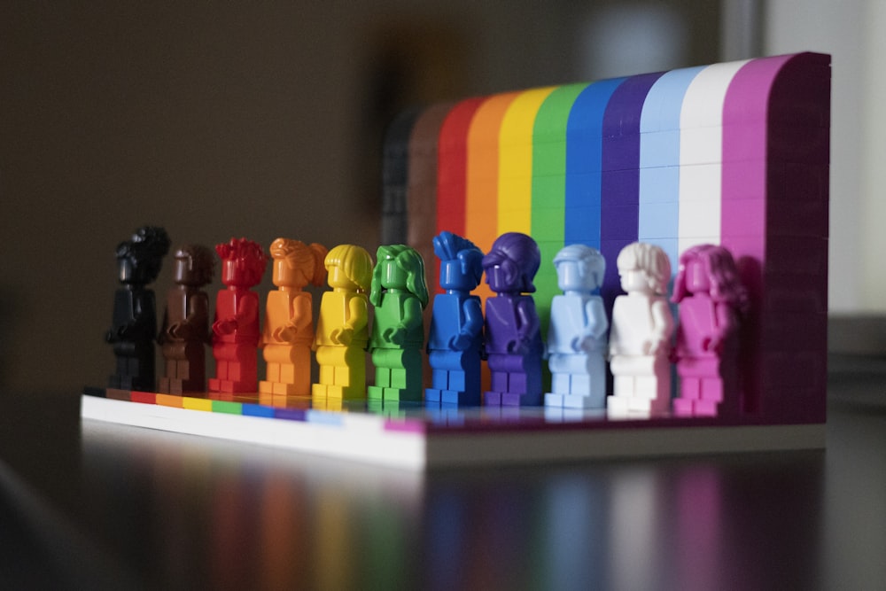 multi colored plastic blocks on white wooden table