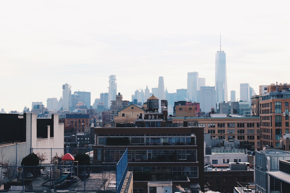 city buildings under white sky during daytime