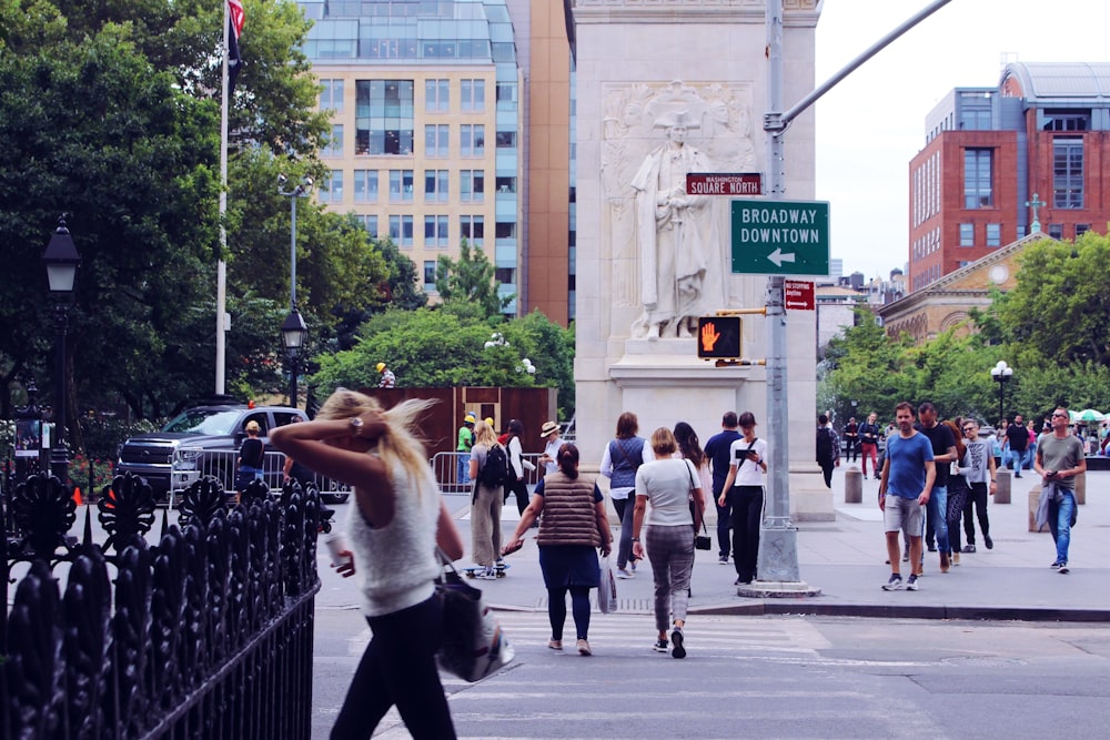 people walking on sidewalk during daytime