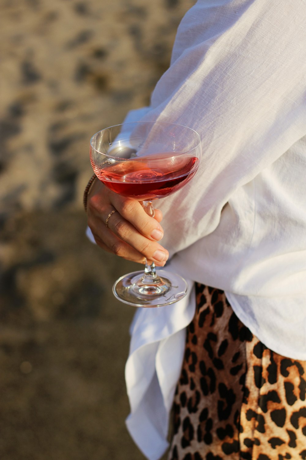 person holding clear wine glass