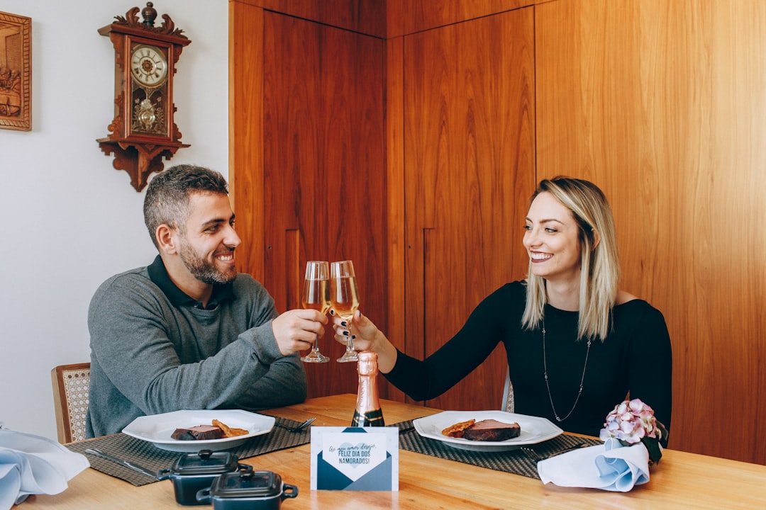 man and woman sitting at table