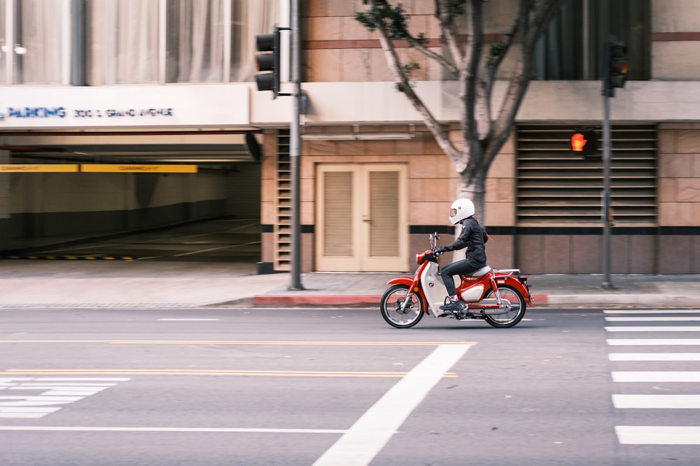 man in black jacket riding motorcycle on road during daytime