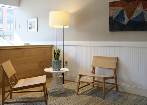 white and brown table lamp on brown wooden table