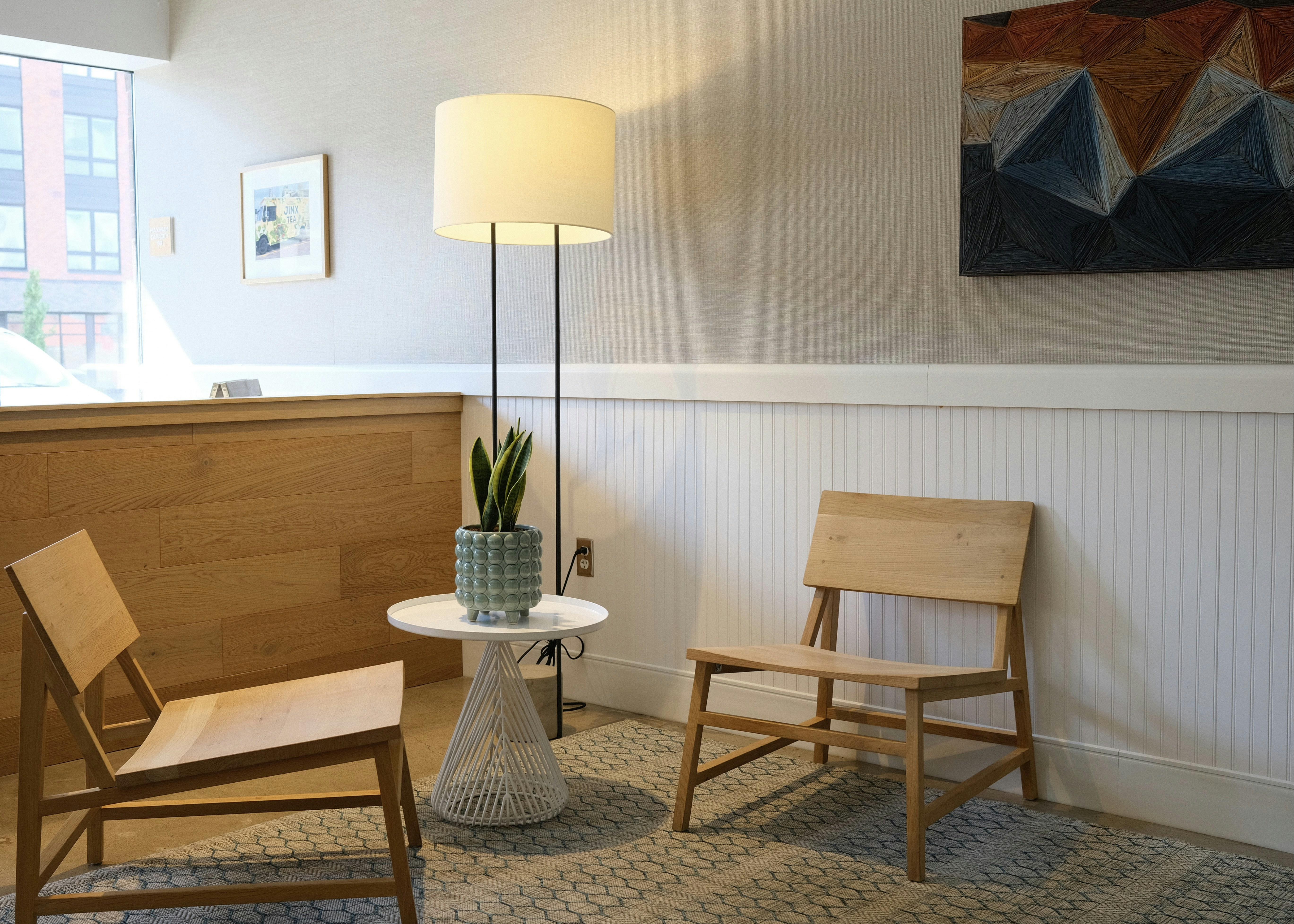 white and brown table lamp on brown wooden table