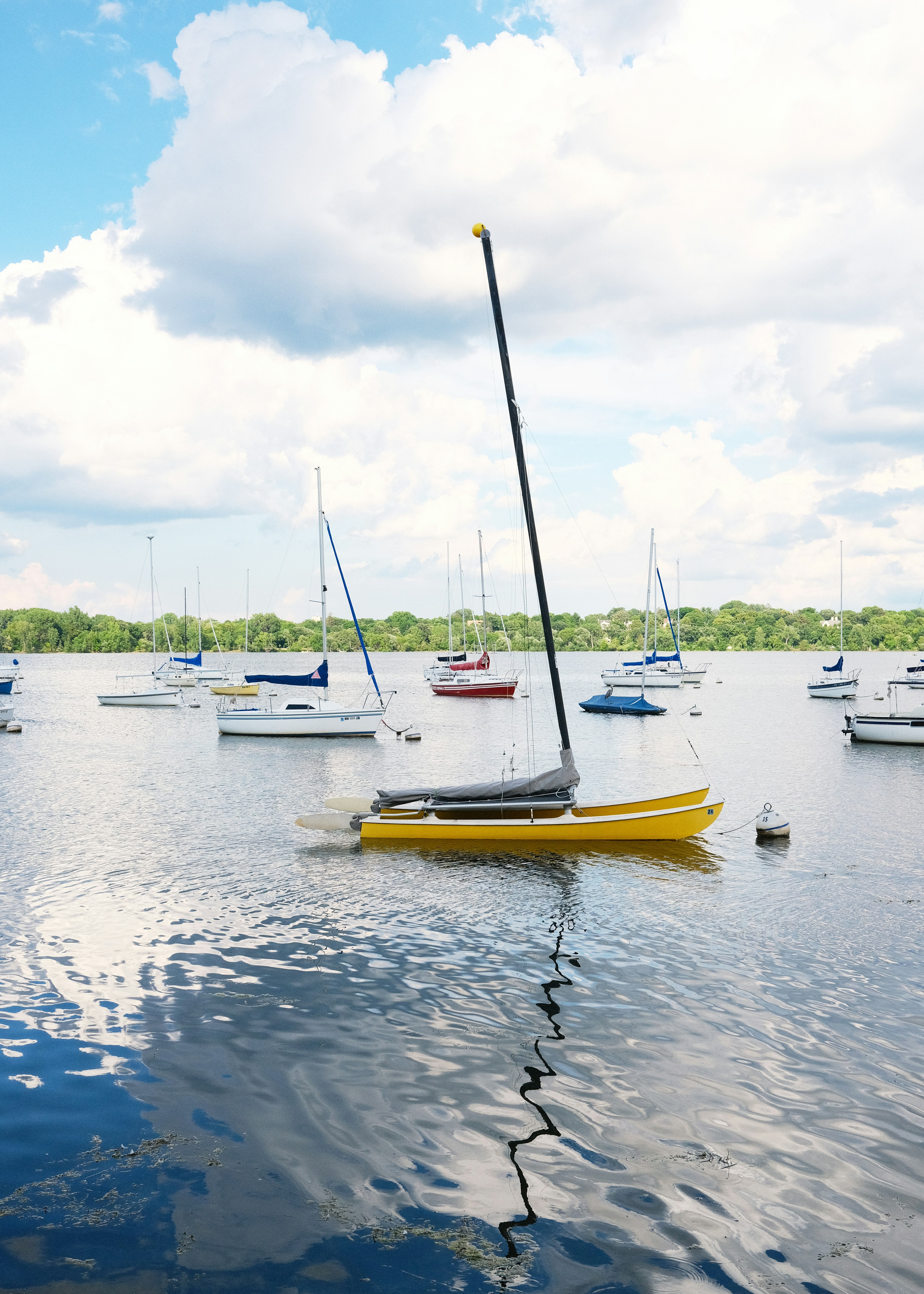 yellow and white boat on water during daytime