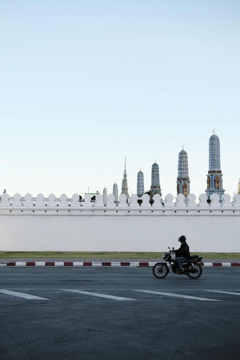 man riding motorcycle on road during daytime