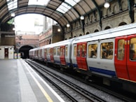 blue and white train on train station during daytime